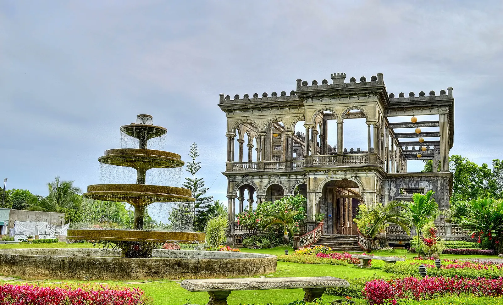 The illuminated skeletal mansion known as The Ruins in Talisay near Bacolod, Negros Occidental, at dusk