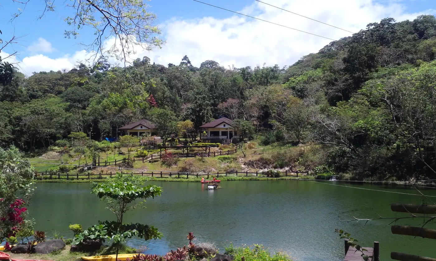 Photo: Choi2451 / CC BY-SA 3.0, via Wikimedia Commons Boating lagoon surrounded by forested hills at Mambukal Resort in Murcia, Negros Occidental