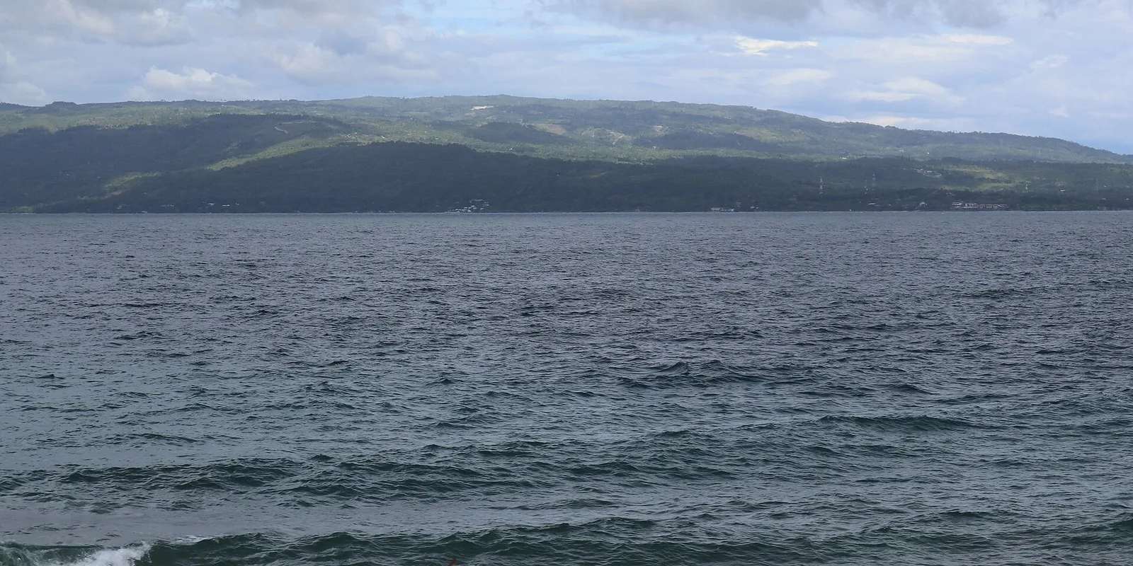 The Tañon Strait seen from the coastal highway at San Jose, Negros Oriental, looking across to Santander on Cebu